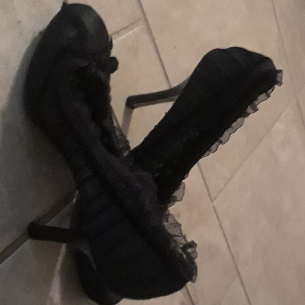 Black heels with cute black ruffle all around